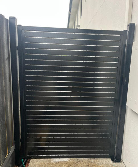 Aluminium Slat Gate Cranbourne Black aluminium slat gate installed at a new build property in Cranbourne