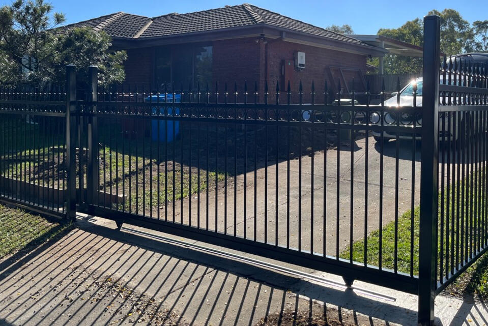 Sliding gate and fence in black speartop design installed in Cranbourne North